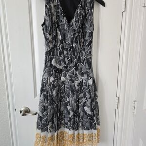 Elegant Black and White Patterned Dress with Gold Accents